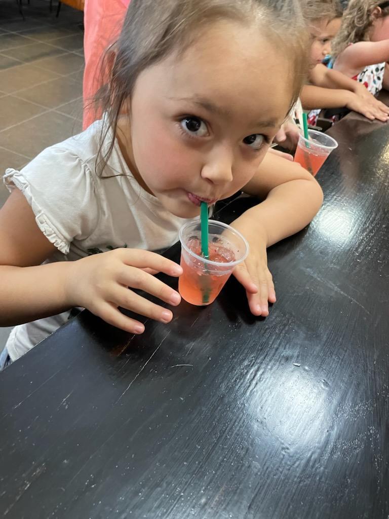 Preschooler enjoying her drink