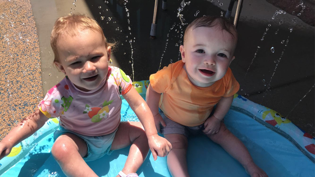 Infant friends enjoying water day together