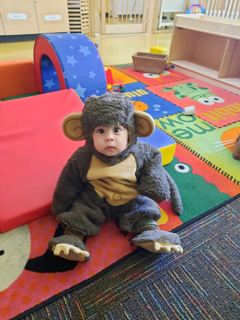 Infant dressed as a monkey