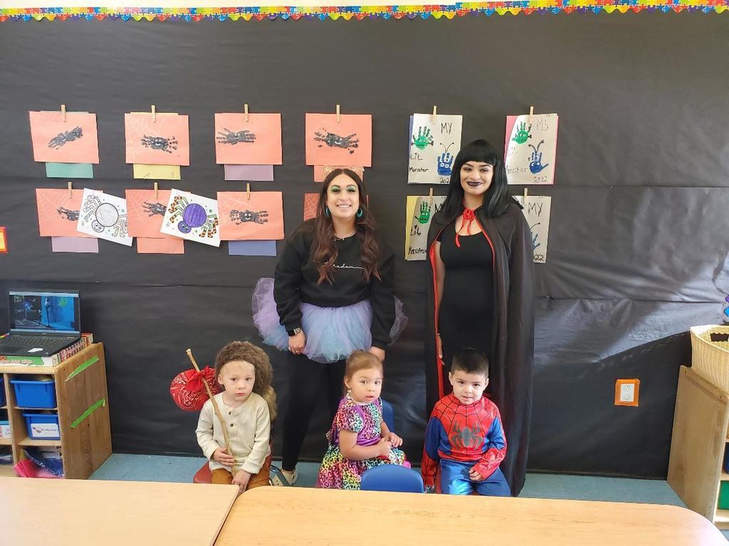 Two year old teachers and 3 students in costumes